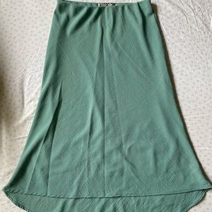 A teal high low skirt